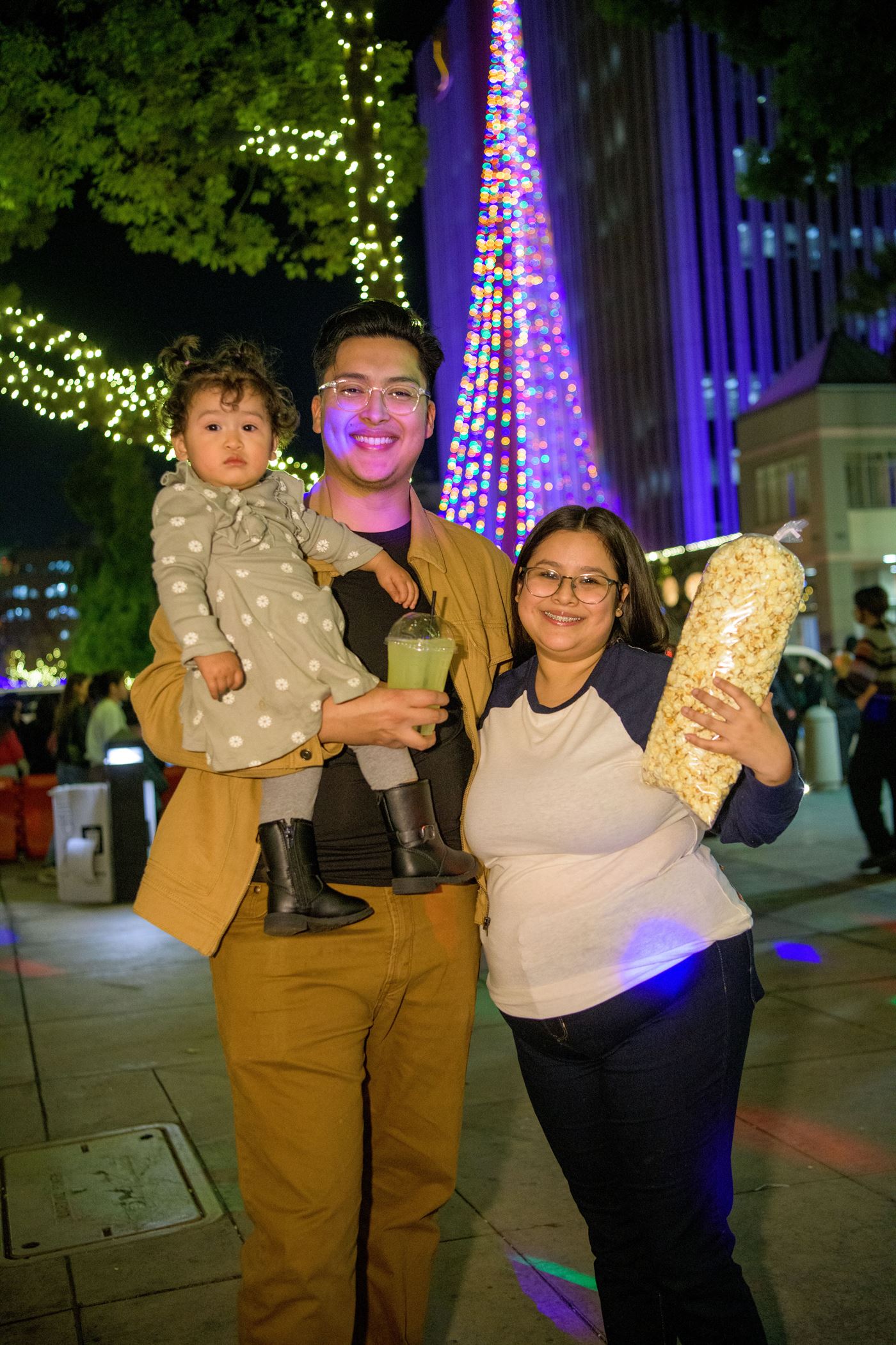Family with popcorn at Festival of Lights