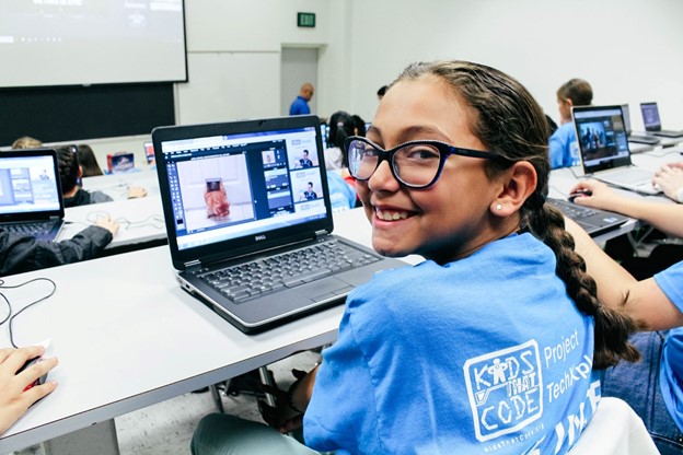 A student wears a Kids That Code t-shirt to the program