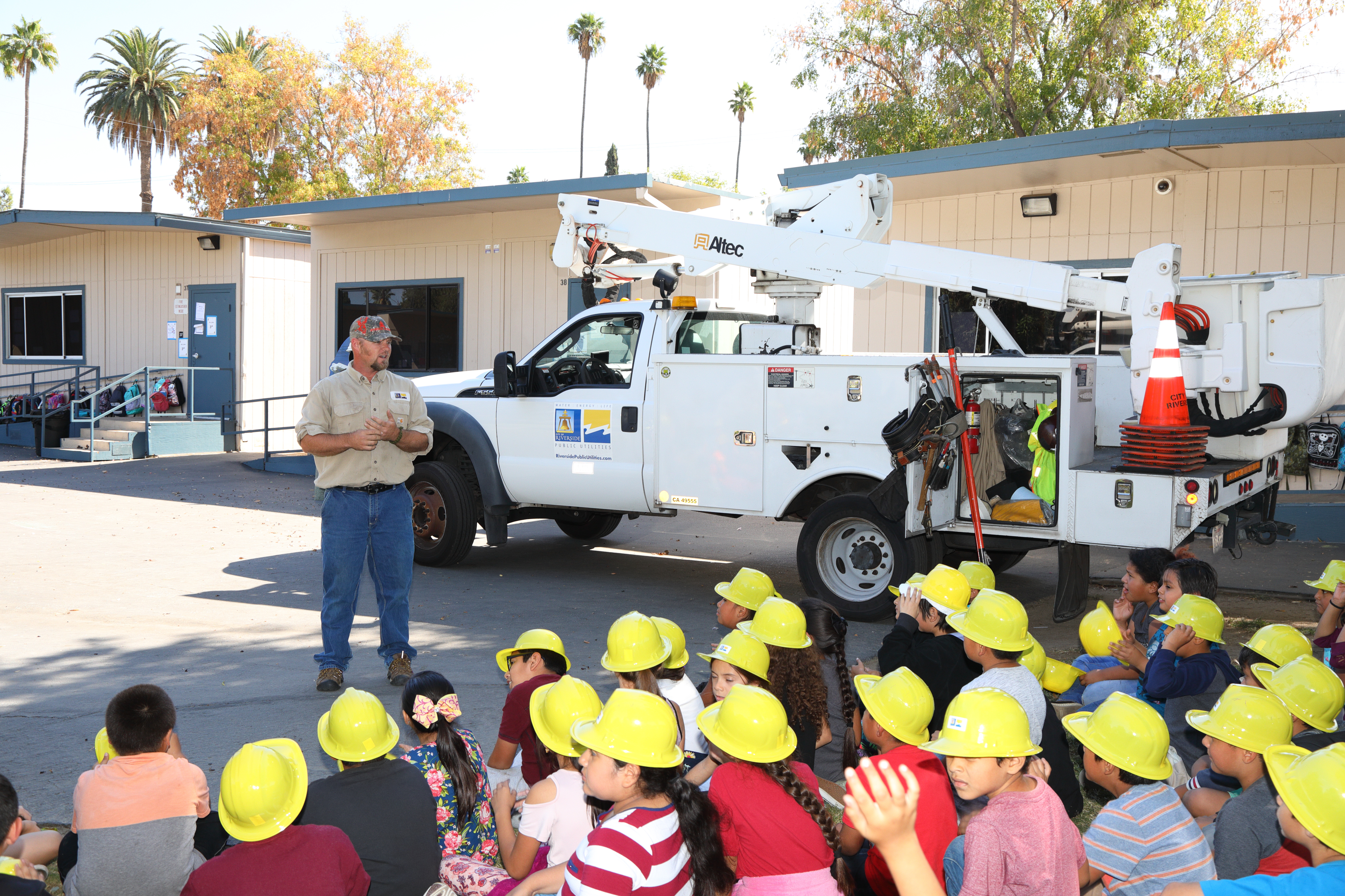 Students learning about utility careers at a school partnership event